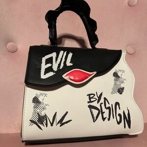 Danielle Nicole Disney Cruella Evil by Design Black and White Handbag.